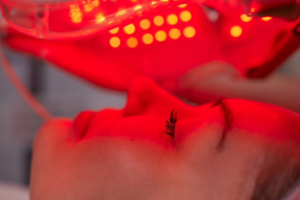 Red LED face mask treatment for collagen stimulation and skin rejuvenation