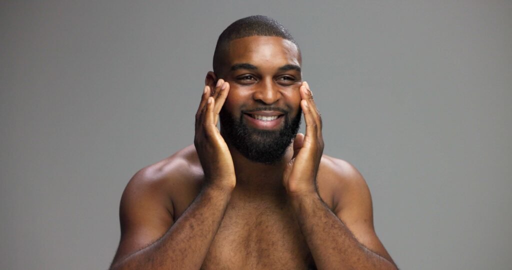 Man with healthy skin and relaxed expression illustrating natural results from male aesthetic treatments